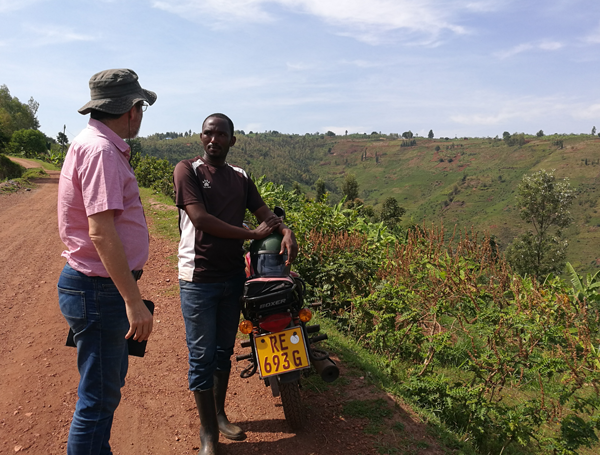 Two people discussing in the field in Rwanda